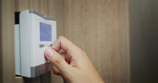 Homeowner Regulates Temperature House Electronic Control Panel — Vídeo de Stock