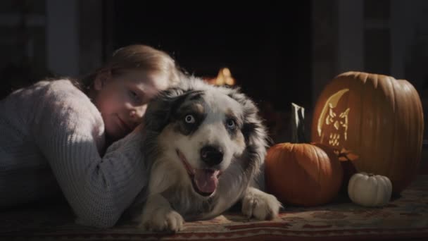 Child Dog Resting Burning Fireplace Next Halloween Decorations — Wideo stockowe