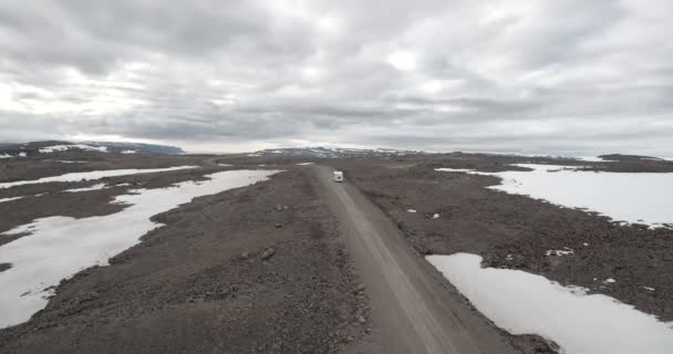 Aerial Camper Driving Empty Snowy Road — стоковое видео