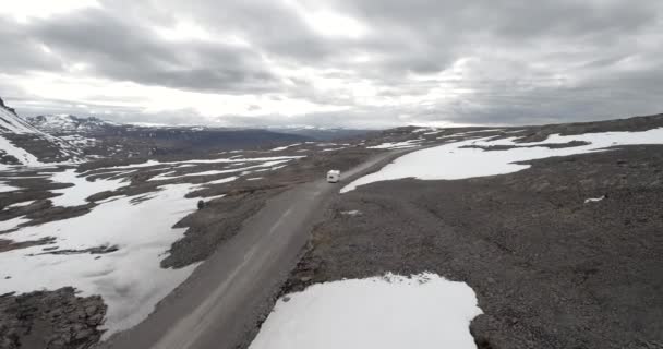 Aerial Camper Driving Empty Snowy Road — стоковое видео