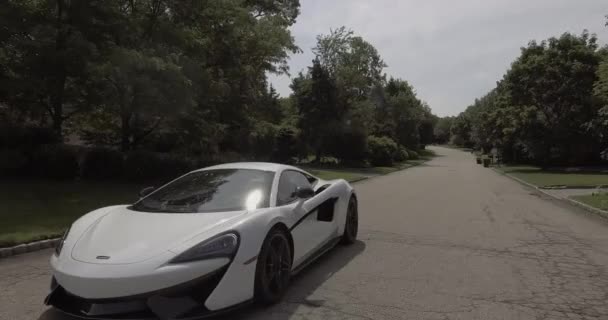 Aerial White Mclaren Supercar Driving Neighborhood — Stock Video