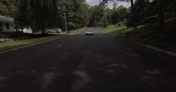 Aerial White Mclaren Supercar Driving Neighborhood — Stock Video