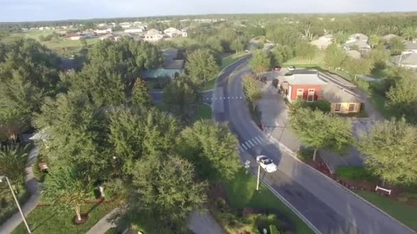 Aerial White Mclaren Driving Neighborhood — Stock Video