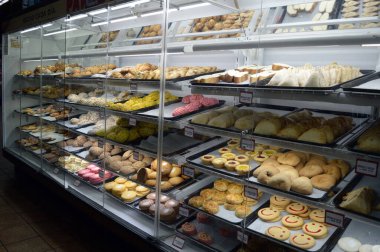 Mexican pastries in a big glass display case