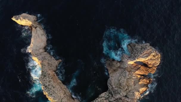 Ses Margalides island, in front of the Gates of Heaven viewpoint in Ibiza at sunset, drone footage. — Stock Video