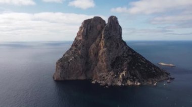 The iconic islands Es Vedra and Es Vedranell, on the west coast of Ibiza. Video recorded with drone.