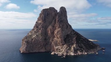 The iconic islands Es Vedra and Es Vedranell, on the west coast of Ibiza. Video recorded with drone.