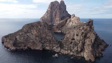 The iconic islands Es Vedra and Es Vedranell, on the west coast of Ibiza. Video recorded with drone.