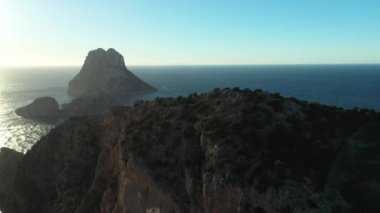 The iconic islands Es Vedra and Es Vedranell, on the west coast of Ibiza. Video recorded with drone.
