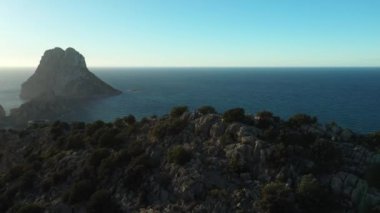 The iconic islands Es Vedra and Es Vedranell, on the west coast of Ibiza. Video recorded with drone.