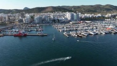 Hyperlapse of marina at sunset. Boats and yachts entering the port. Sant Antoni. Ibiza.