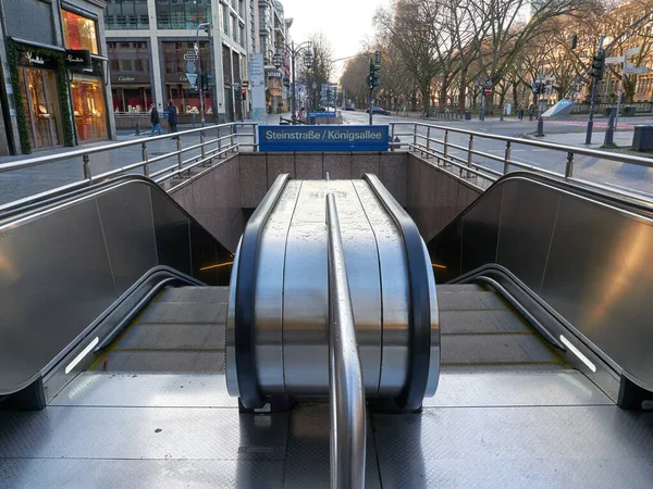 stock image Dusseldorf, Germany - December 25, 2020: Konigsallee Avenue. Signboard and underground entrance with escalators on Steinstrasse-Konigsallee