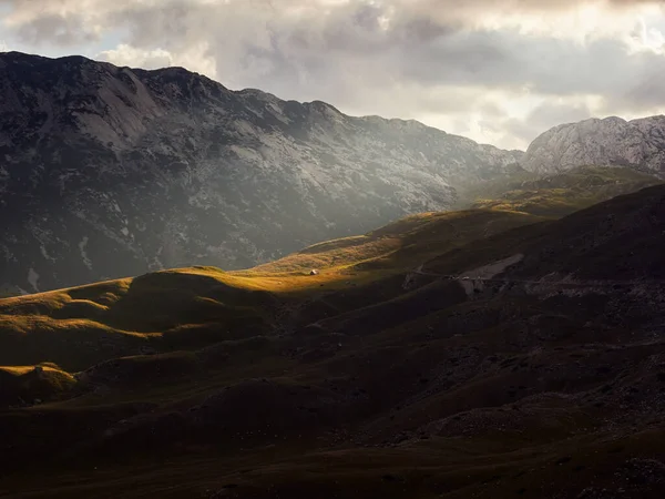 The slopes of the Durmitor mountains lit by the golden rays of the setting sun. Durmitor National Park in Montenegro