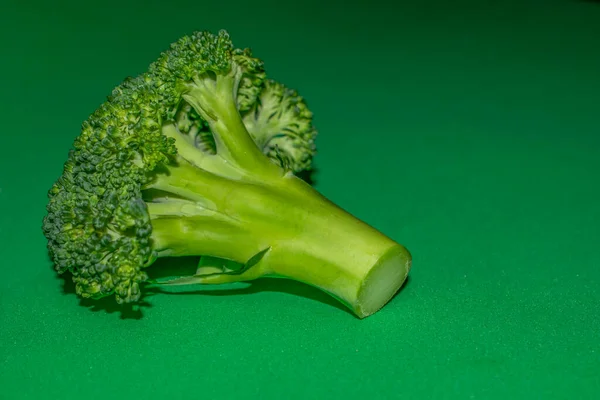broccoli on a green background close-up