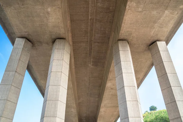 Bottom View Big Concrete Bridge Four Pillars Blue Sky Background — Stock Photo, Image