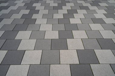 Paved floor with light gray and dark gray square stones