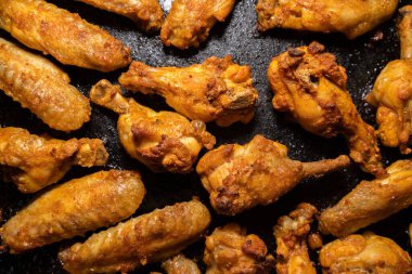 Crispy grilled chicken wings on a baking tray