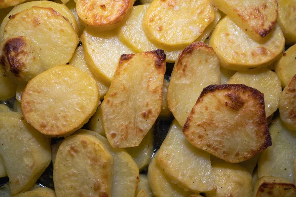 Crispy baked potato slices on a baking sheet