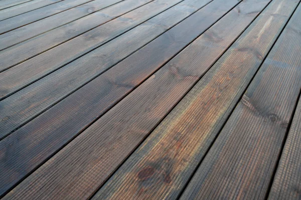 Background with brown wet wood decking