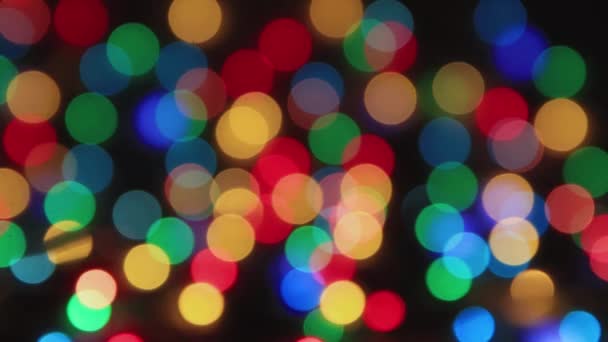 Multi-colored lights on a black background blinking, copy space. — Stock Video