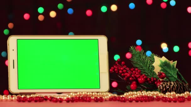 Protector de pantalla de vídeo de Navidad - tableta con croma key y línea verde. — Vídeo de stock