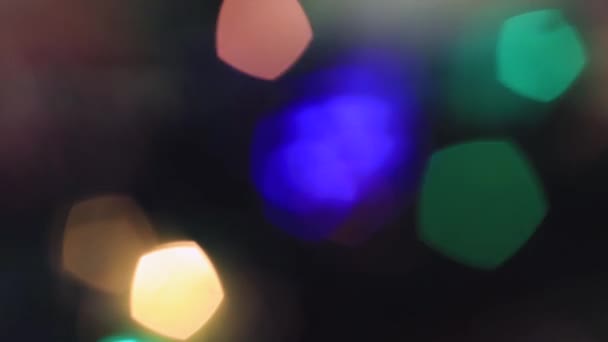 Out of focus Christmas colored lights flicker. — Stock Video