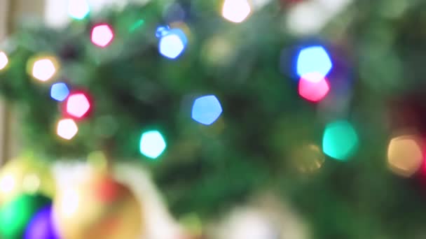 Blurred Christmas beautiful multicolored lights are burning brightly. — Stock Video