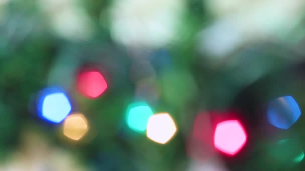 Blurred Christmas festive colorful lights are burning brightly. — Stock Video
