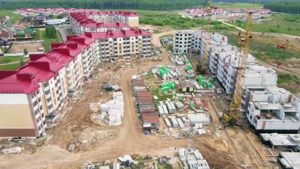 Modern multi-storey building under construction, aerial view. — Stock Video