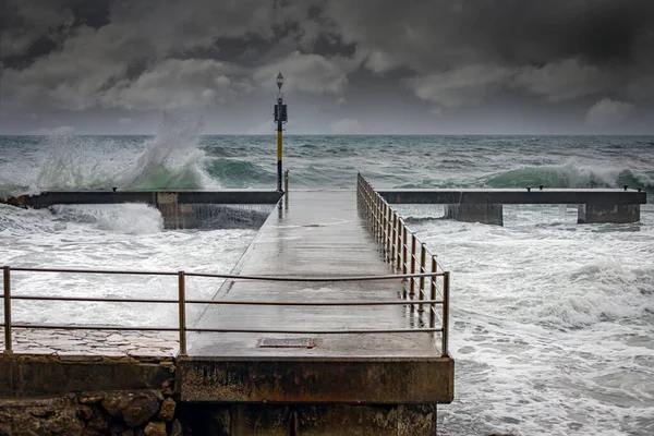 Stormy Ocean Waves Splashing Pier Durring Winters Storm Stock Photo