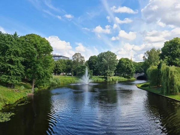 Narrow canal for boating among the trees in the city park in summer — Stock Photo, Image