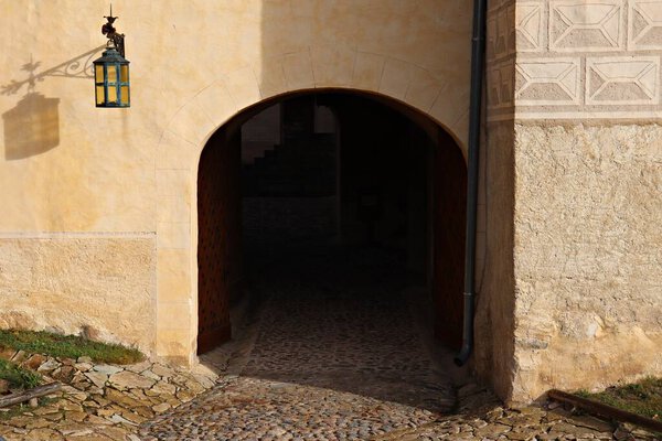 Large arch in the thick wall for access to the courtyard.