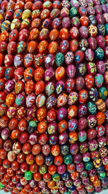 Many decorative Easter eggs painted with beautiful bright colors are stacked in the church museum.