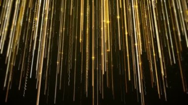 Siyah bir arkaplanda altın renkli soyut figür