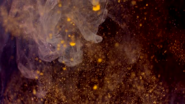 Colored dust on a black background, falling locally from top to bottom in slow motion — Vídeo de Stock