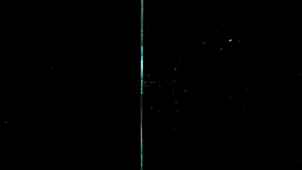 Fragments of broken glass fly in different directions on a black background. — Vídeo de Stock