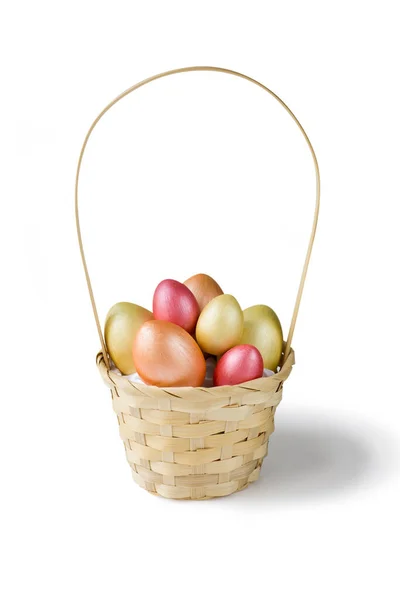 Golden, bronze and pink Easter eggs in basket isolated on white background. Design element for greeting cards, poster or banner.