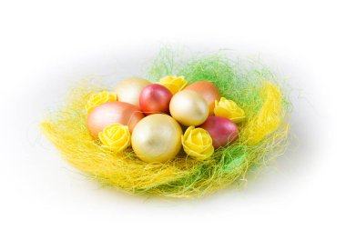 Golden, bronze and pink Easter eggs with flowers in colored nest isolated on white background. Design element for greeting cards, poster or banner.