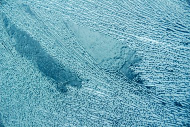 Buz dokusu arka planı. Mavi ve soğuk renklerin tüm tonları.