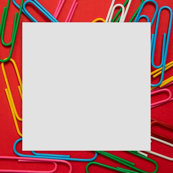 Creative Layout Made Colorful Paper Clips Red Background Cube Paper — Stock Photo, Image