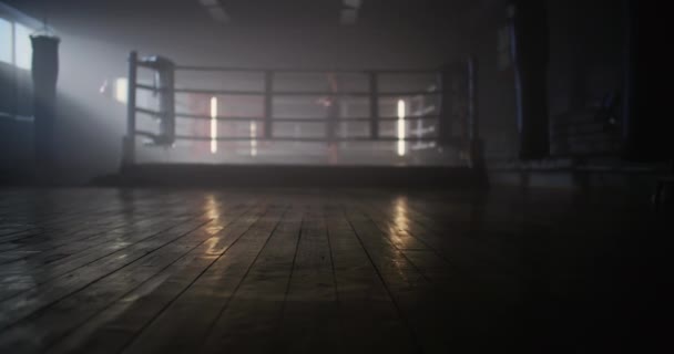 Out of Focus Shot: Young Woman Boxer With her Hands Wrapped in Bandage Jumping on Rope in Dark Ring Space a Gym with Smoke. — стокове відео