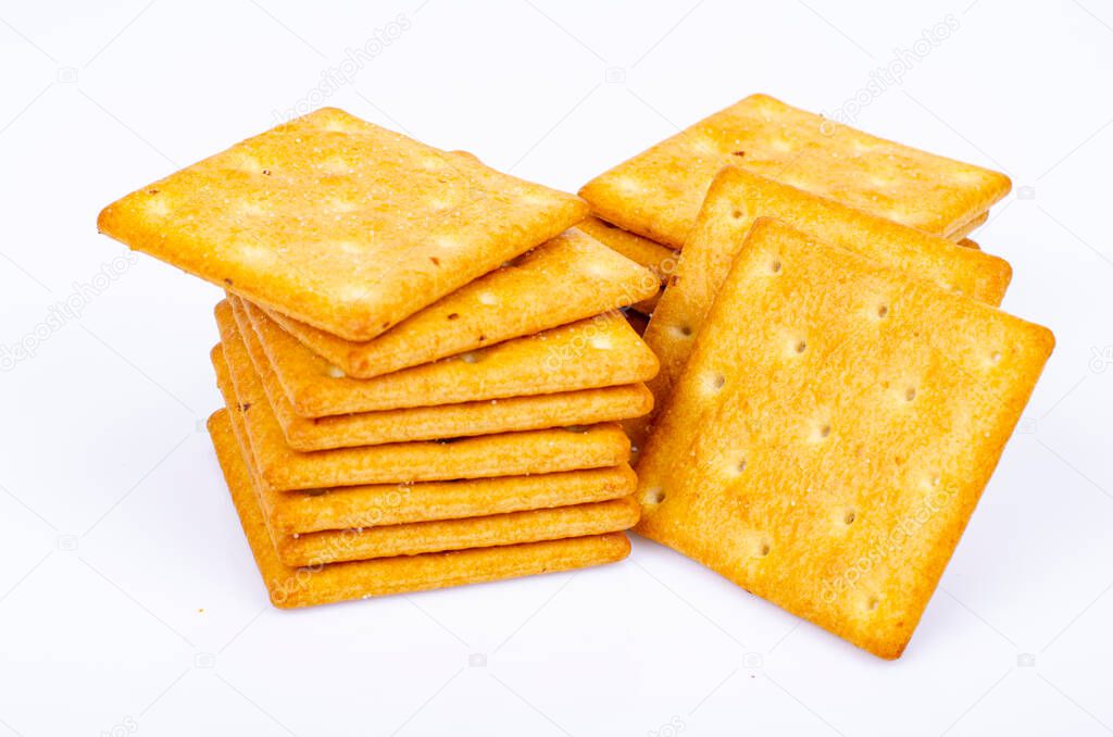 Delicious salty golden biscuit cracker square shape. Studio Photo