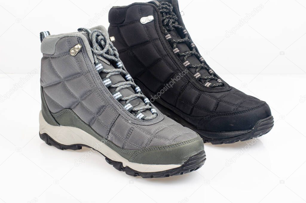Winter waterproof insulated sports shoes on white background. Photo