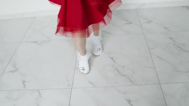 Close up girls legs on high heels, red dress — стоковое видео