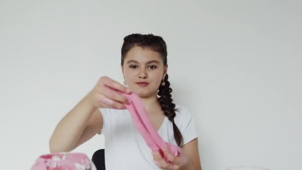 Joyful actions with slime, beautiful girl — стоковое видео