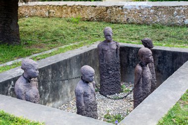 Slavery monument with sculptures near the former slave trade place in Stone town, Zanzibar
