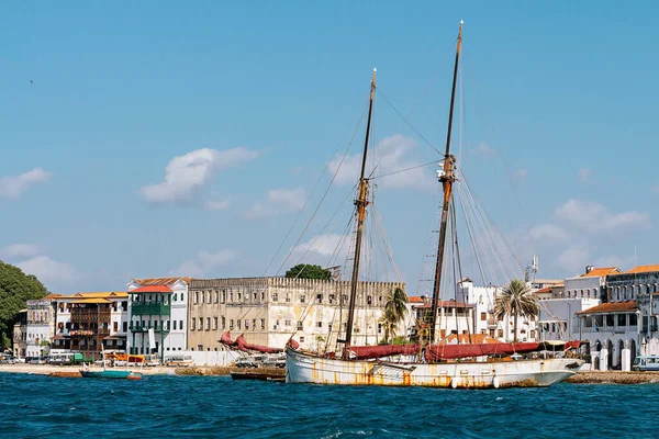 View of the big boat and the houses of the Stone Town. Zanzibar. Tanzania.