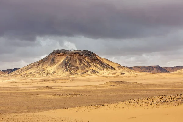 View of the Black and White Desert before a thunderstorm. Baharia. Egypt