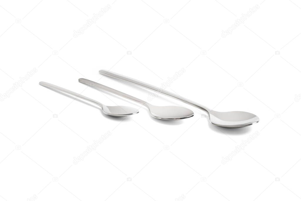 Clean shiny metal spoon isolated on white. Stainless steel small kitchen dessert teaspoon cut close up. Tablespoon. Kitchen utensils concept. Set of realistic spoons from different points of view