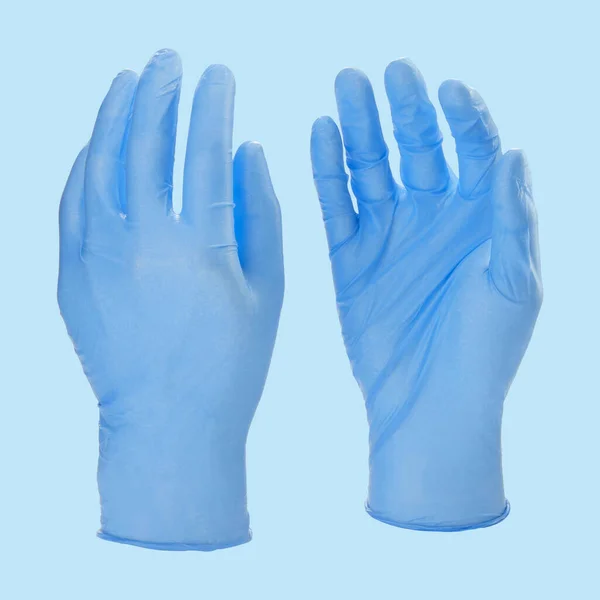 Dvě modré latexové zdravotnické rukavice izolované na bílém pozadí bez rukou — Stock fotografie
